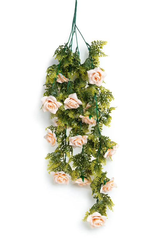 Guirnalda colgante artificial con follaje verde y rosas color rosa claro, ideal para decorar bodas, eventos, arcos florales, techos y espacios interiores.
